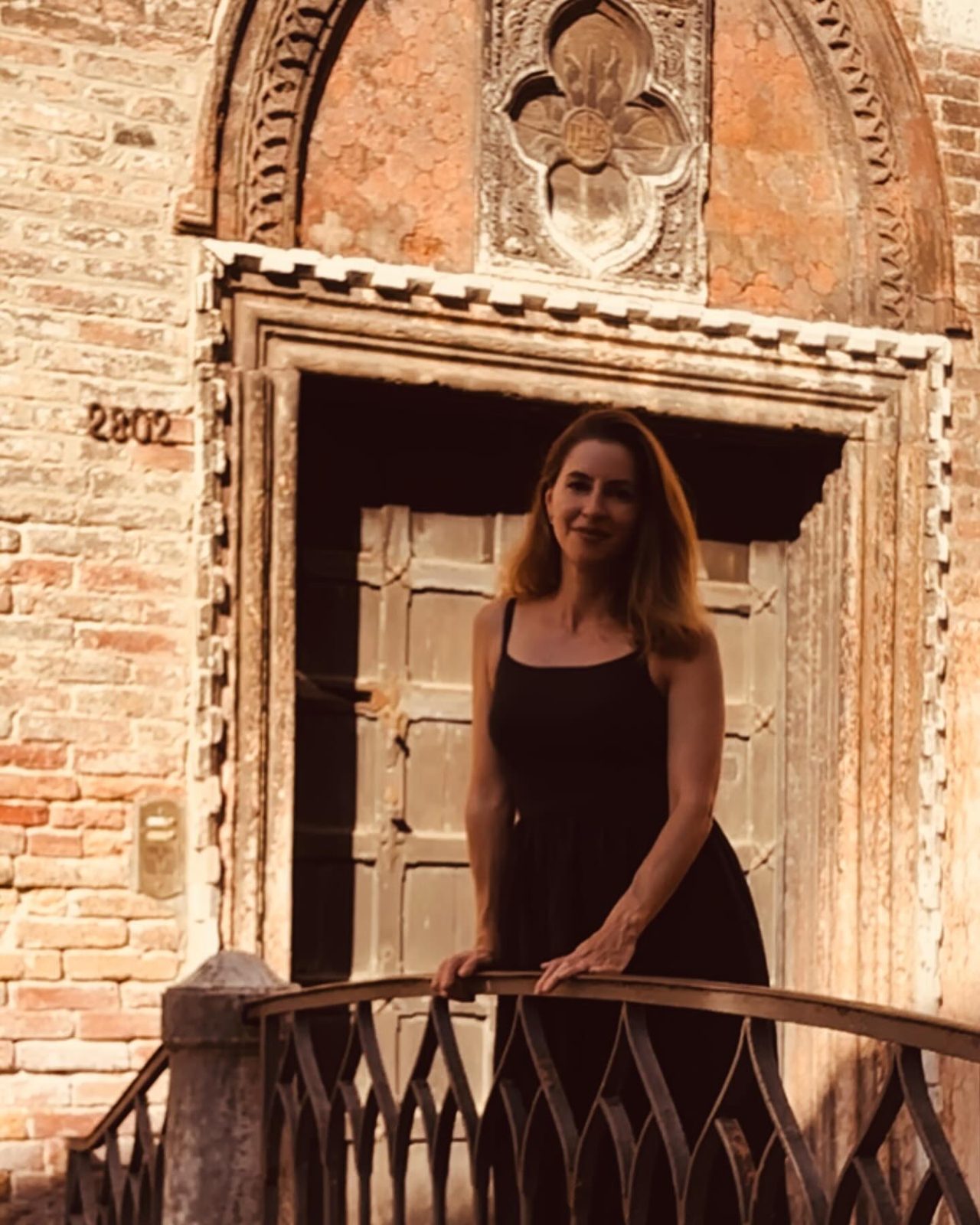 Iva Perez on a balcony in Venice